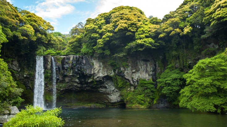 Cheonjiyeon waterfall in Jeju Island bike tours in south korea